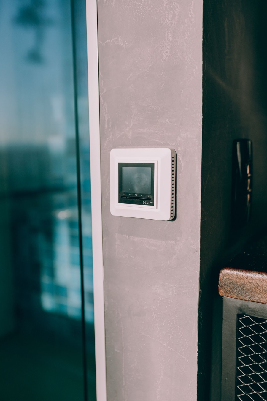 Smart thermostat installed on a wall